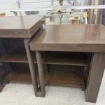 6' Espresso Coffee Shop Sales Counter with ADA drop right & two 11 shelves 5 Two dark brown wooden workbenches with open shelves underneath, in a workshop with tools on a nearby table.
