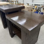 6' Espresso Coffee Shop Sales Counter with ADA drop right & two 11 shelves 6 Two dark-stained wooden workbenches in a woodworking shop, with drill presses and tools in the background