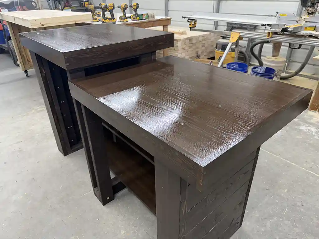 6' Espresso Coffee Shop Sales Counter with ADA drop right & two 11 shelves 6 Two dark-stained wooden workbenches in a woodworking shop, with drill presses and tools in the background