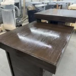 6' Espresso Coffee Shop Sales Counter with ADA drop right & two 11 shelves 7 Dark brown wooden desk with a raised shelf in a woodworking workshop, glossy finish on the surface.