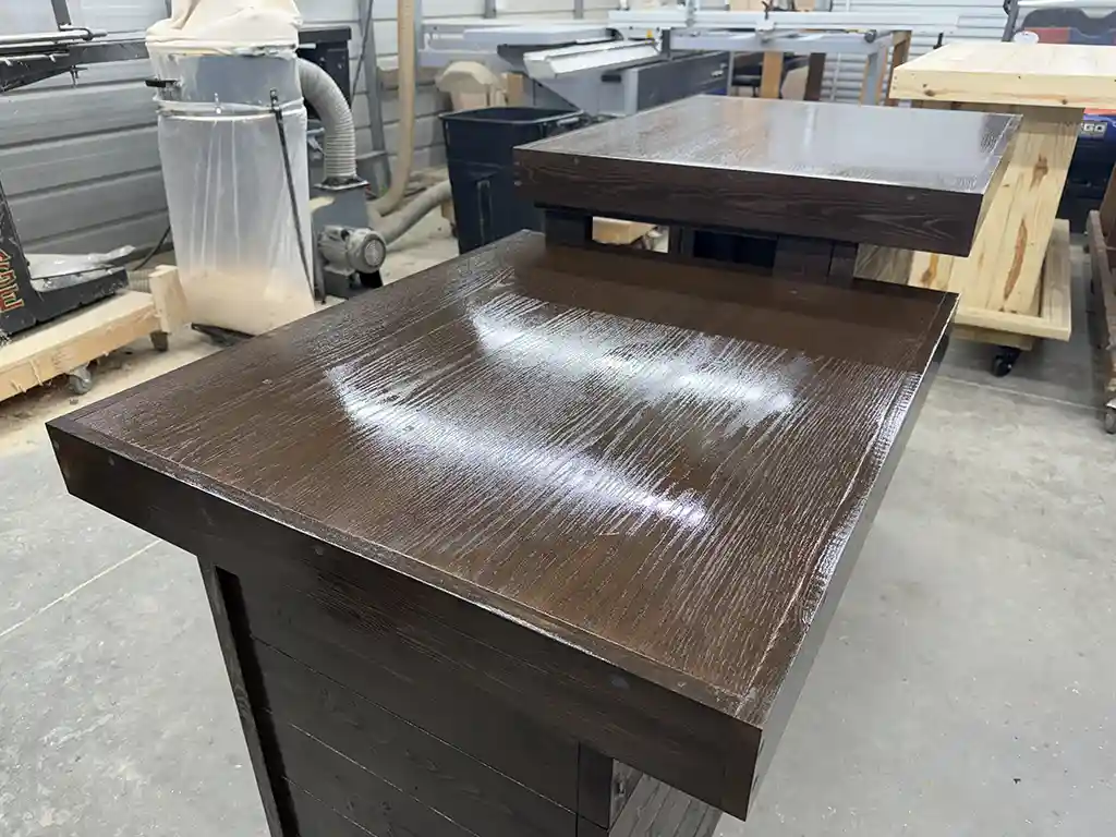 6' Espresso Coffee Shop Sales Counter with ADA drop right & two 11 shelves 7 Dark brown wooden desk with a raised shelf in a woodworking workshop, glossy finish on the surface.